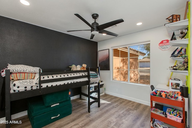 game room with hardwood / wood-style floors and ceiling fan