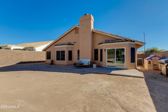 back of property featuring central AC and a patio