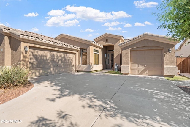 4667 E County Down Dr, Chandler, AZ 85249 - view of front of house featuring concrete driveway, a garage, stucco siding, and a tile roof