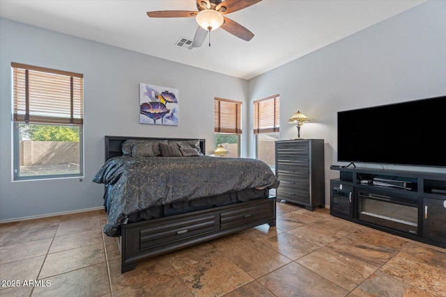 4667 E County Down Dr, Chandler, AZ 85249 - bedroom with multiple windows, ceiling fan, and vaulted ceiling