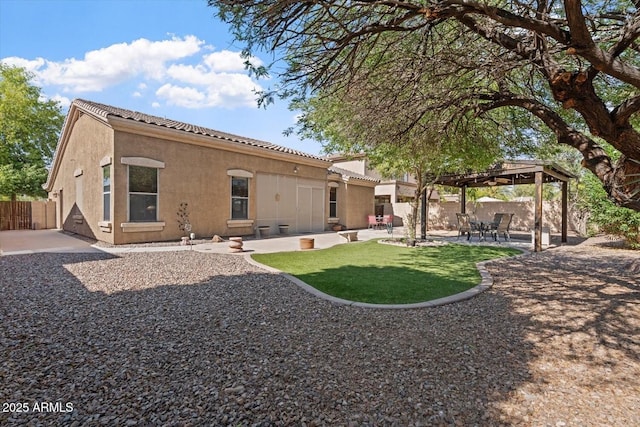 4667 E County Down Dr, Chandler, AZ 85249 - back of house featuring a pergola, stucco siding, a patio, a fenced backyard, and a tiled roof
