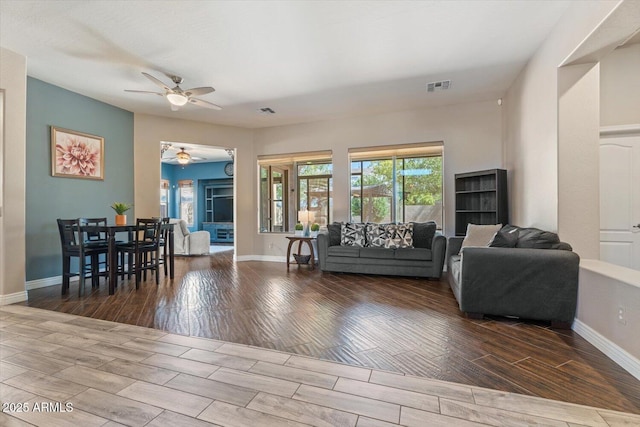 4667 E County Down Dr, Chandler, AZ 85249 - living room featuring ceiling fan, wood finished floors, and healthy amount of natural light