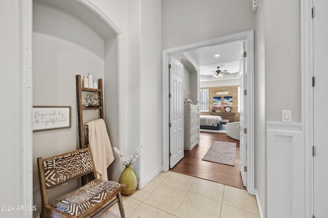 hallway with light hardwood / wood-style floors