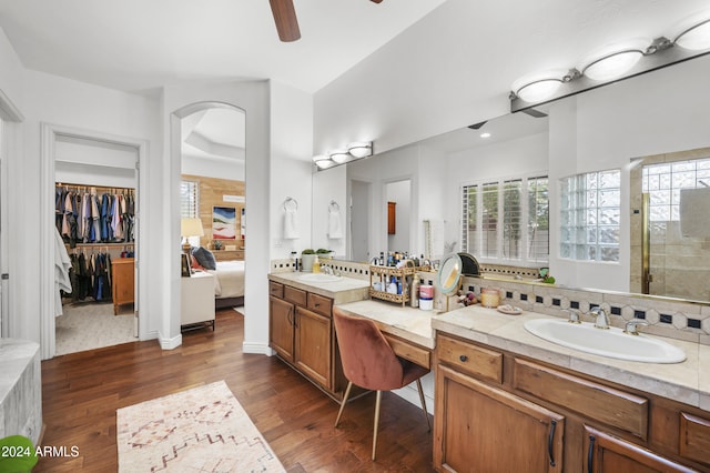 bathroom featuring ceiling fan, wood-type flooring, and vanity