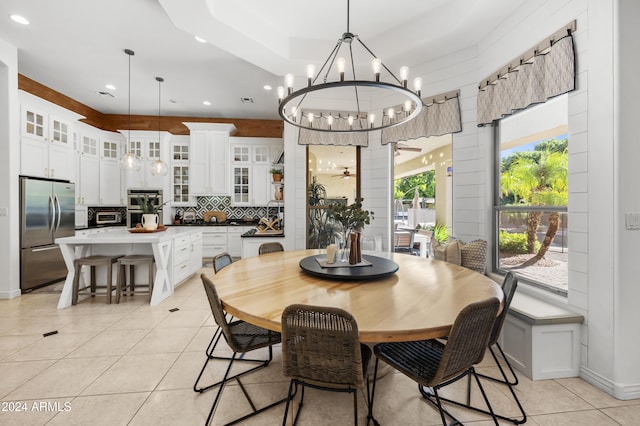 dining space featuring an inviting chandelier and light tile patterned floors