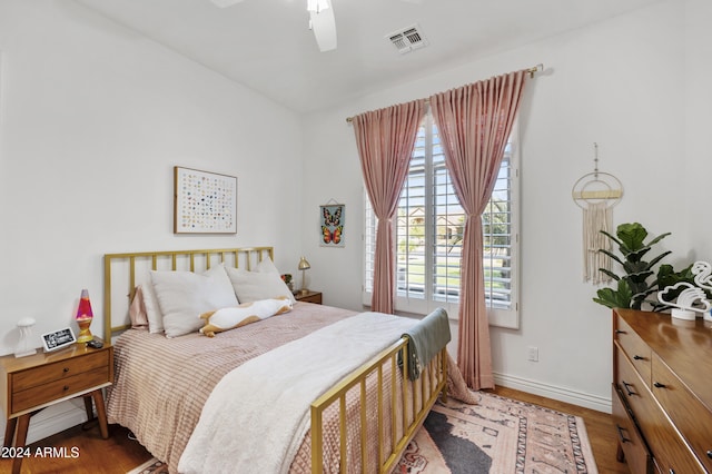 bedroom featuring hardwood / wood-style flooring and ceiling fan