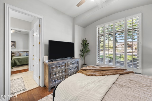 bedroom with light hardwood / wood-style floors and ceiling fan