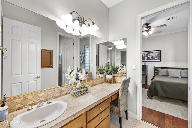 bathroom featuring vanity, hardwood / wood-style flooring, ceiling fan, and crown molding