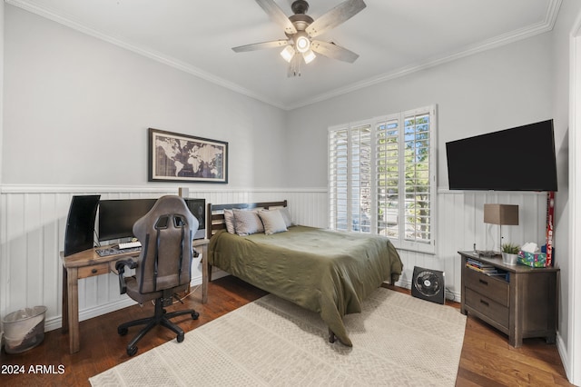 bedroom featuring hardwood / wood-style floors, ceiling fan, and crown molding