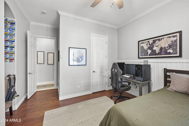 bedroom with dark hardwood / wood-style flooring, ornamental molding, and ceiling fan