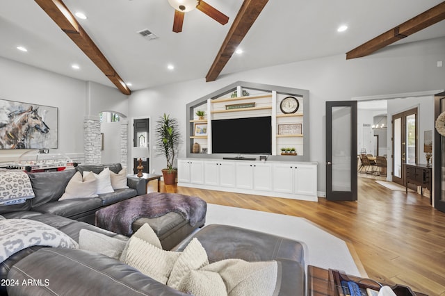 living room with vaulted ceiling with beams, light wood-type flooring, french doors, and ceiling fan