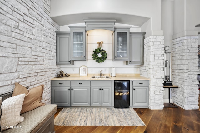 kitchen with gray cabinets and dark hardwood / wood-style flooring