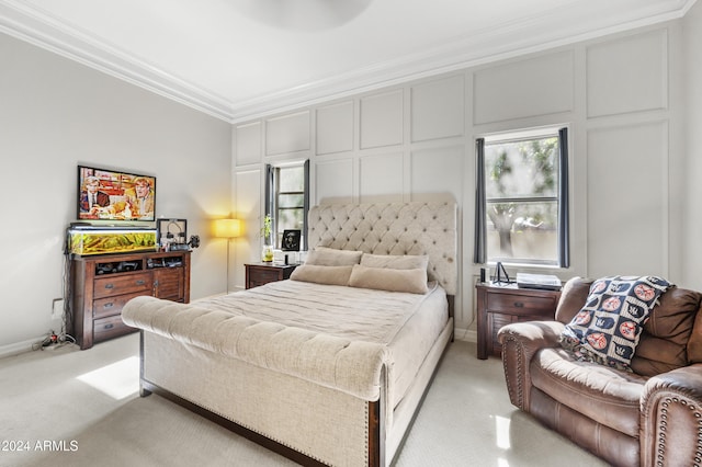 bedroom with multiple windows, light colored carpet, and ornamental molding