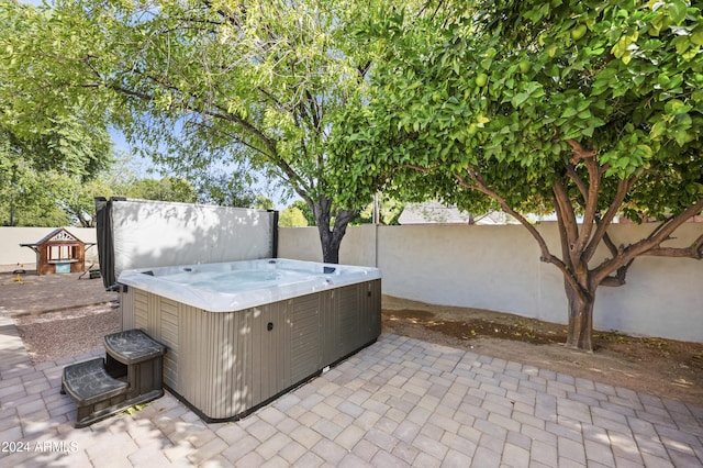 view of patio with a hot tub