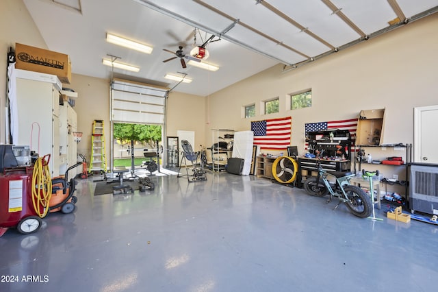 garage featuring a garage door opener and ceiling fan