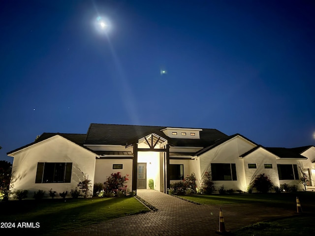 view of front of house with a lawn