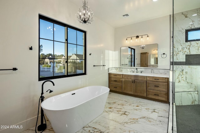 bathroom featuring independent shower and bath, vanity, and a chandelier