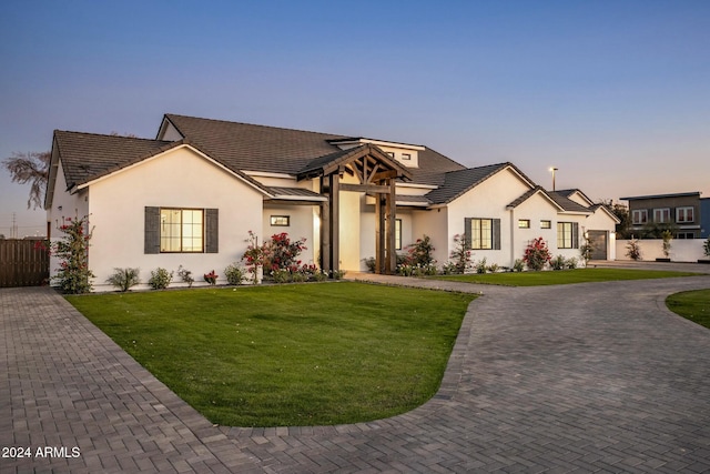 view of front of property with a lawn