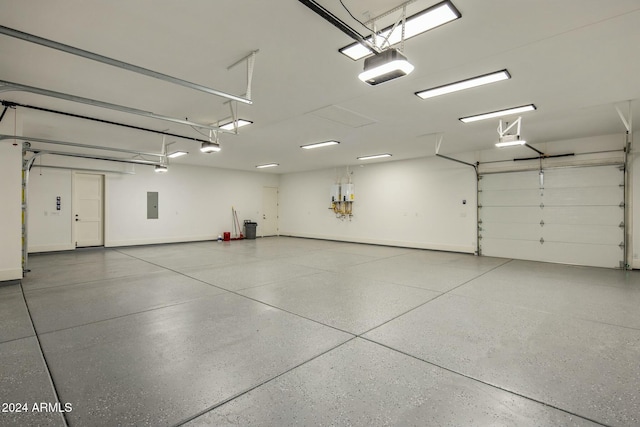 garage featuring electric panel and a garage door opener