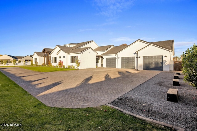 view of front of home with a garage and a front yard