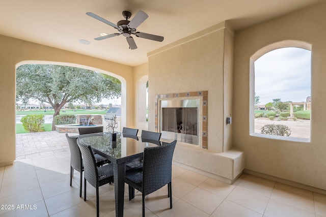 view of patio / terrace featuring outdoor dining space and a ceiling fan