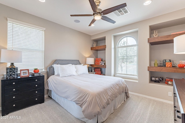 carpeted bedroom featuring recessed lighting, baseboards, visible vents, and ceiling fan