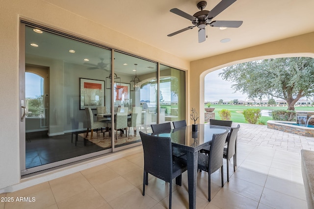 view of patio / terrace featuring outdoor dining space and a ceiling fan