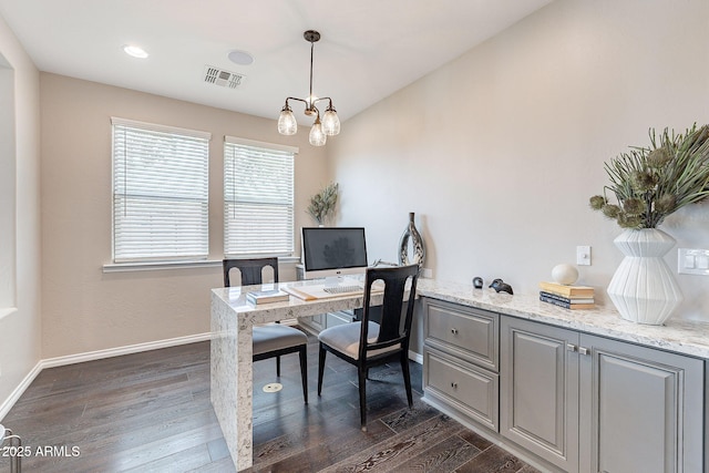 home office with visible vents, baseboards, dark wood-type flooring, and an inviting chandelier