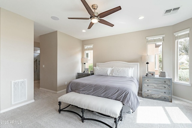 bedroom with multiple windows, carpet flooring, and visible vents