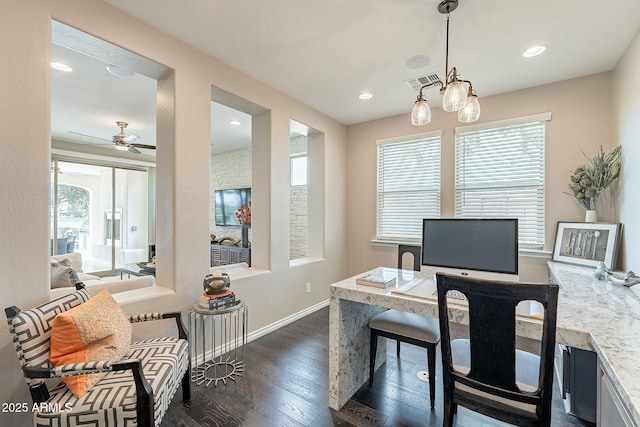 office space featuring visible vents, plenty of natural light, baseboards, and dark wood-style flooring