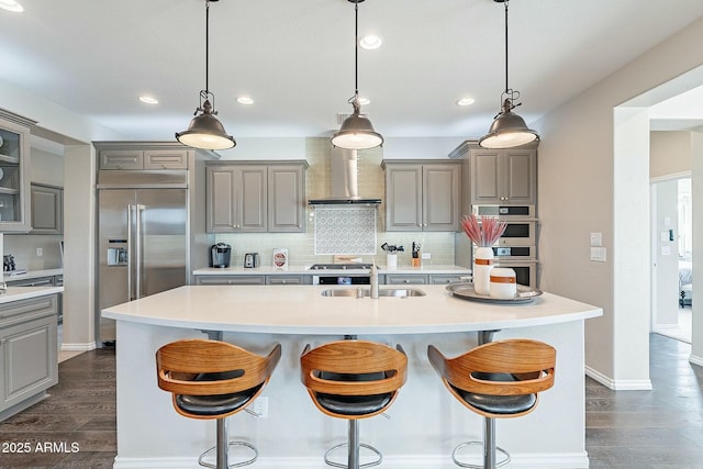 kitchen with gray cabinets, stainless steel appliances, and a sink