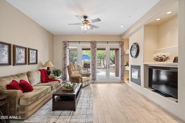 2221 W Calle De Las Estrella Way, Phoenix, AZ 85085 - living area with wood finished floors, french doors, ceiling fan, and recessed lighting