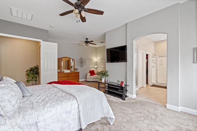 2221 W Calle De Las Estrella Way, Phoenix, AZ 85085 - bedroom with arched walkways, light colored carpet, and ceiling fan