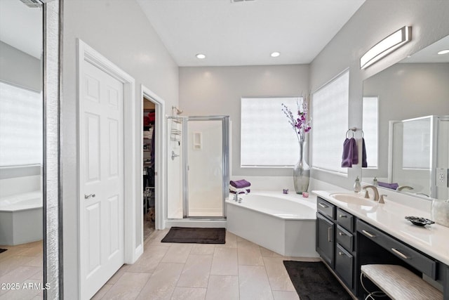 2221 W Calle De Las Estrella Way, Phoenix, AZ 85085 - full bath with a shower stall, a garden tub, a walk in closet, vanity, and recessed lighting