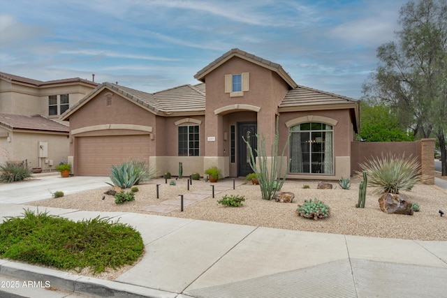 2221 W Calle De Las Estrella Way, Phoenix, AZ 85085 - view of front of property with an attached garage, stucco siding, concrete driveway, and a tile roof
