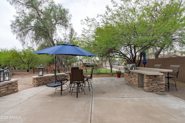 2221 W Calle De Las Estrella Way, Phoenix, AZ 85085 - fenced backyard with exterior kitchen, a patio, and outdoor dining area