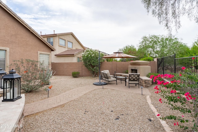 2221 W Calle De Las Estrella Way, Phoenix, AZ 85085 - fenced backyard featuring a patio and an outdoor hangout area