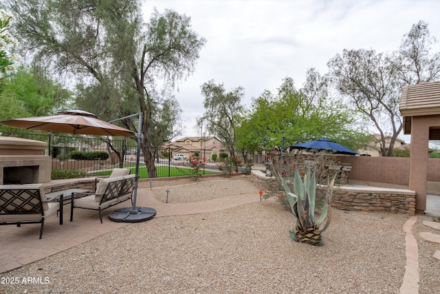 2221 W Calle De Las Estrella Way, Phoenix, AZ 85085 - view of yard with a patio and an outdoor living space with a fireplace