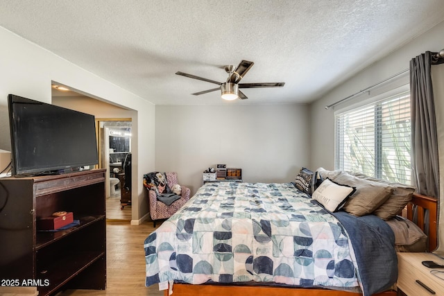 1915 S 39th St Unit 37, Mesa, AZ 85206 - bedroom with a textured ceiling, ceiling fan, and wood finished floors