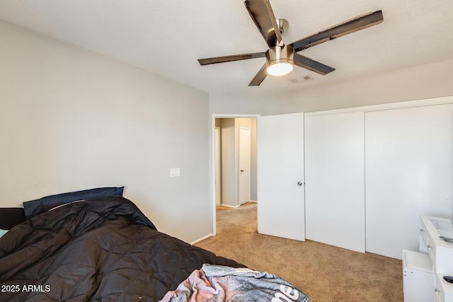 bedroom with carpet flooring, a ceiling fan, visible vents, and a closet