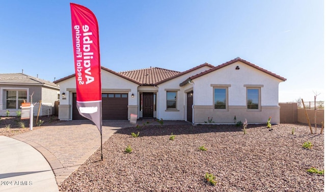 view of front of property with a garage