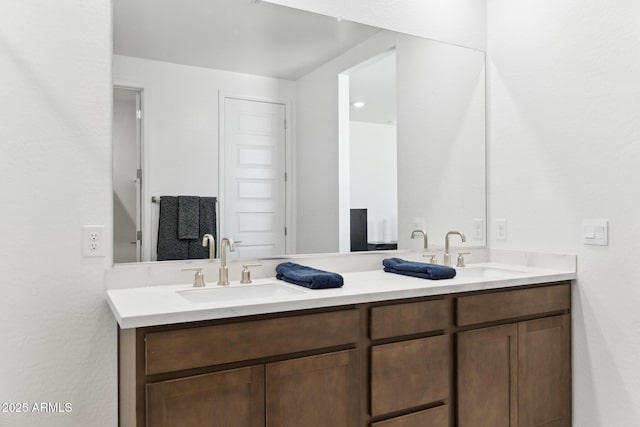 bathroom with double vanity and a sink