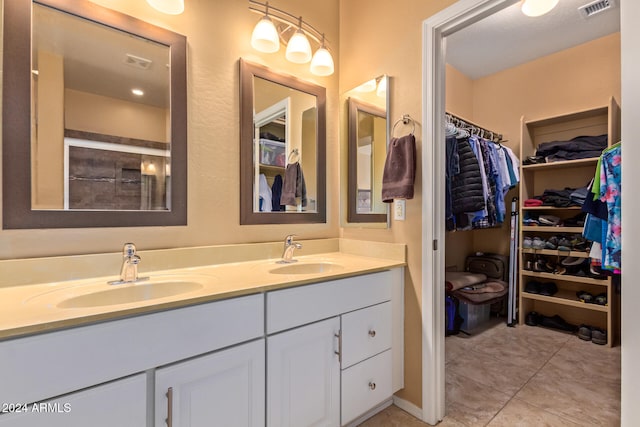 bathroom featuring tile patterned floors and vanity