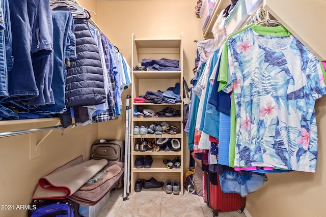 walk in closet featuring tile patterned flooring