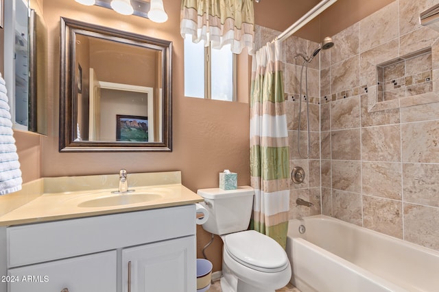 full bathroom featuring toilet, vanity, and shower / bath combination with curtain