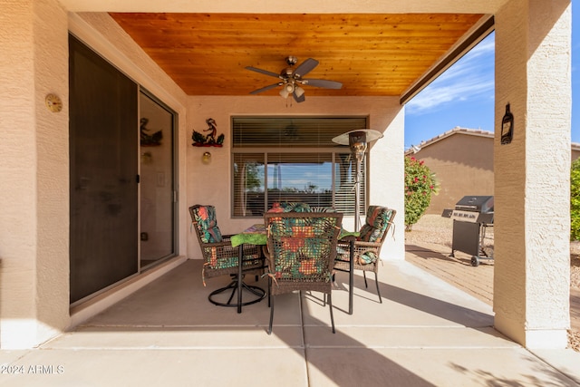 view of patio / terrace with ceiling fan and a grill