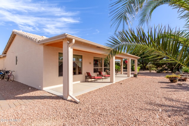 back of property with a patio area