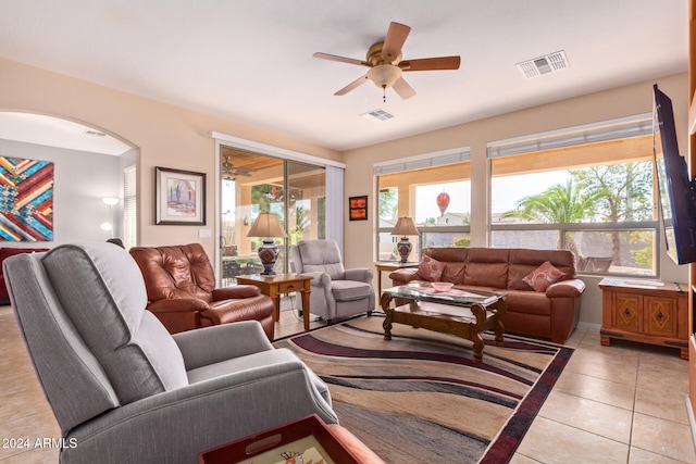 living room with ceiling fan and light tile patterned floors