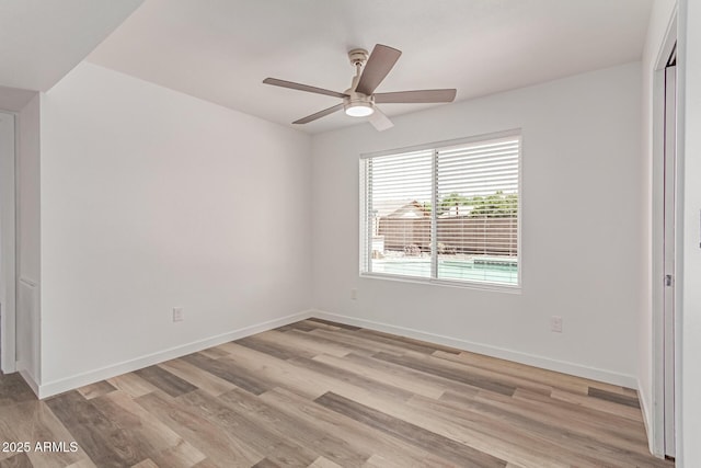 5721 W Palo Verde Ave, Glendale, AZ 85302 - unfurnished bedroom with light wood-style floors, baseboards, and a ceiling fan