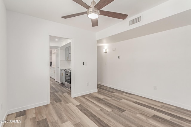 5721 W Palo Verde Ave, Glendale, AZ 85302 - unfurnished room featuring ceiling fan, light wood finished floors, and baseboards